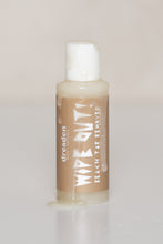 Load image into Gallery viewer, Dresden Holden acupuncturist in santa barbara made Wipe Out, a nontoxic clean beach tar remover for santa barbara beaches. 2 ounce plastic bottle with a no mess cap and a brown label that says Wipe Out! The is photo has a drop of the product running down the front of the bottle to show the thick consistency and color