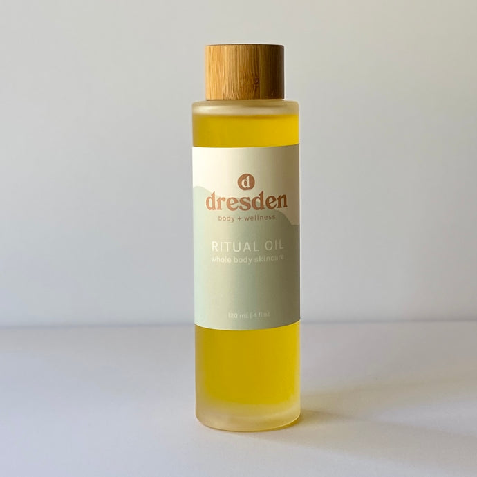 Dresden Body + Wellness Ritual Oil glass bottle with a bamboo cap, all over skincare