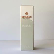 Load image into Gallery viewer, Dresden Body + Wellness Ritual Oil in box with green mountain, cedarwood, woodsy scent body oil
