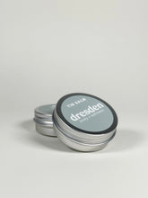 Load image into Gallery viewer, Aluminum jar of Yin Balm, a botanical balm formulated for vulvar comfort and moisture support. Made with herb-infused oils, cocoa butter, mango butter, evening primrose oil, and beeswax for dry, sensitive intimate skin.