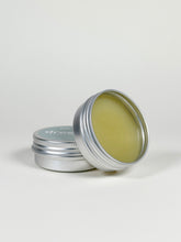 Load image into Gallery viewer, Aluminum jar of Yin Balm, a botanical balm formulated for vulvar comfort and moisture support. Made with herb-infused oils, cocoa butter, mango butter, evening primrose oil, and beeswax for dry, sensitive intimate skin.