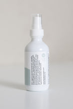 Load image into Gallery viewer, Dresden Holden Acupuncturist in santa barbara california 2 ounce bottle of organic facial oil using frankincense and blue tansy essential oil in a white glass bottle with a blue label and blue writing in an elegant style showing the INCI list
