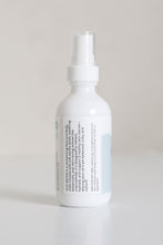 Load image into Gallery viewer, Dresden Holden Acupuncturist in Santa Barbara Ca made Silk water a hydrating toner with organic hydrosols, niacinamide, glycerin, silk amino acids, and is pH balanced to hydrate and heal the skin barrier, in a 2 ounce white glass bottle with a label written in blue font
