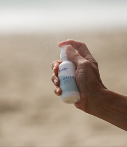 Dresden Holden Santa Barbara Based Acupuncturist and Silk Water spraying into the air to show a fine mist spray for this hydrating pH balanced toner