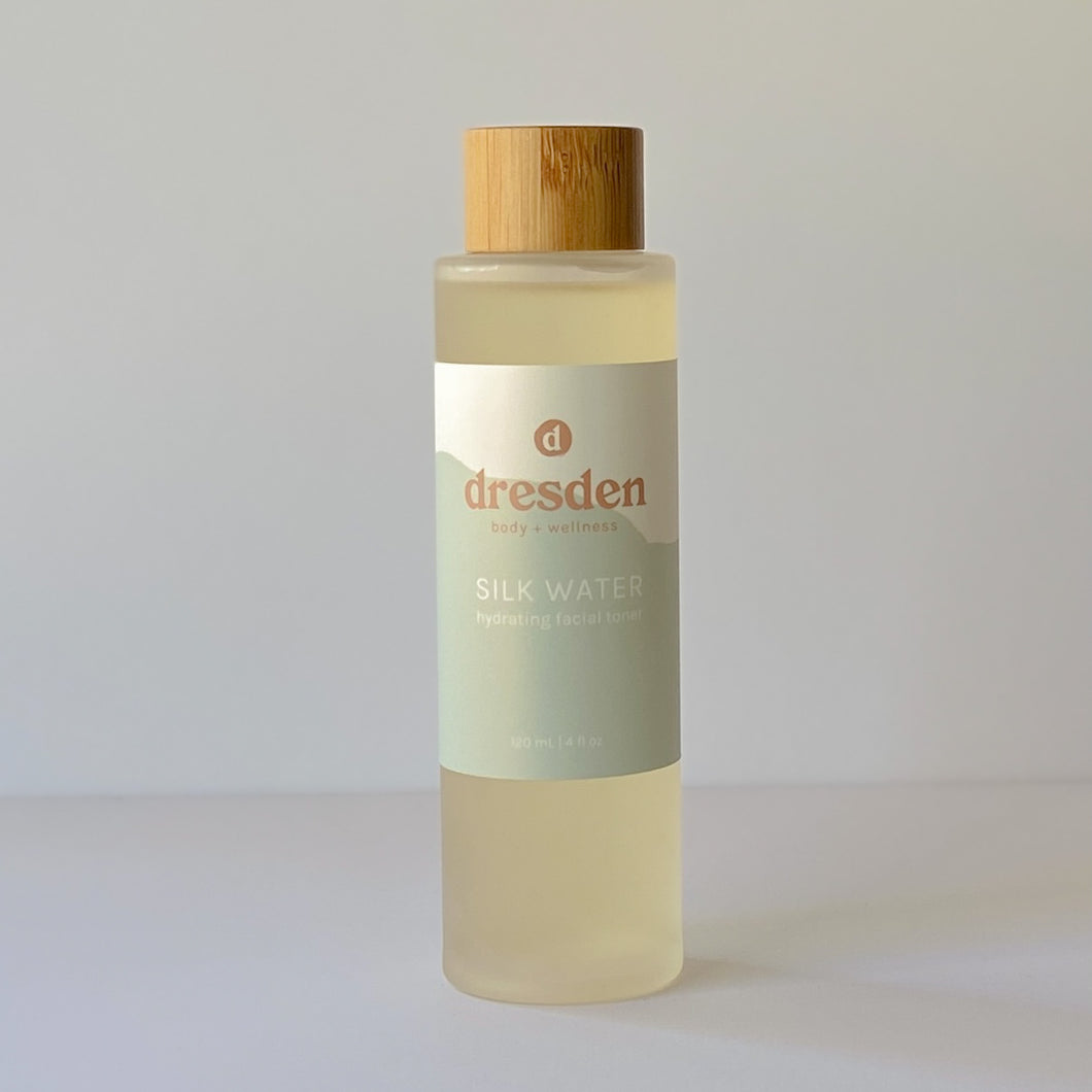 Dresden Body + Wellness Silk Water, hydrating facial toner in a glass bottle with a bamboo screw cap, naturally ph balanced 5.5