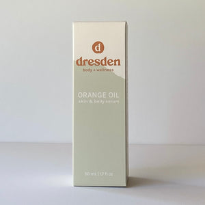 Dresden Body + Wellness orange oil, skin and body and belly oil, box with green mountain background, santa barbara, california